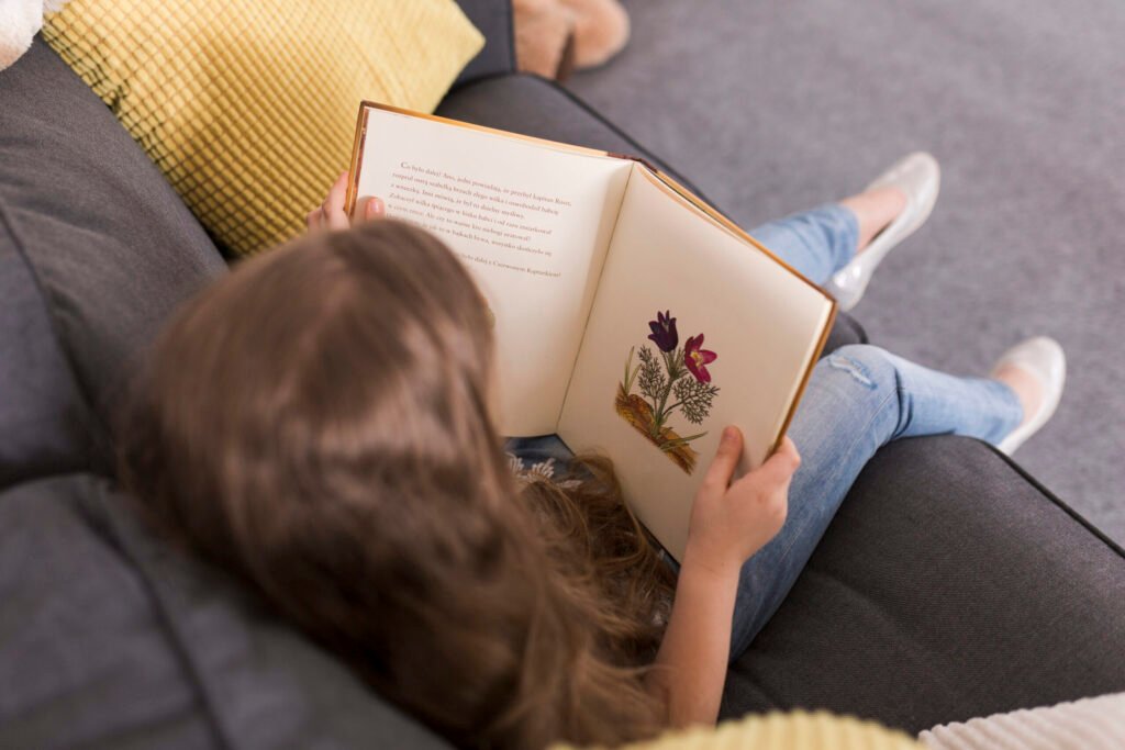 girl-reading-book-couch